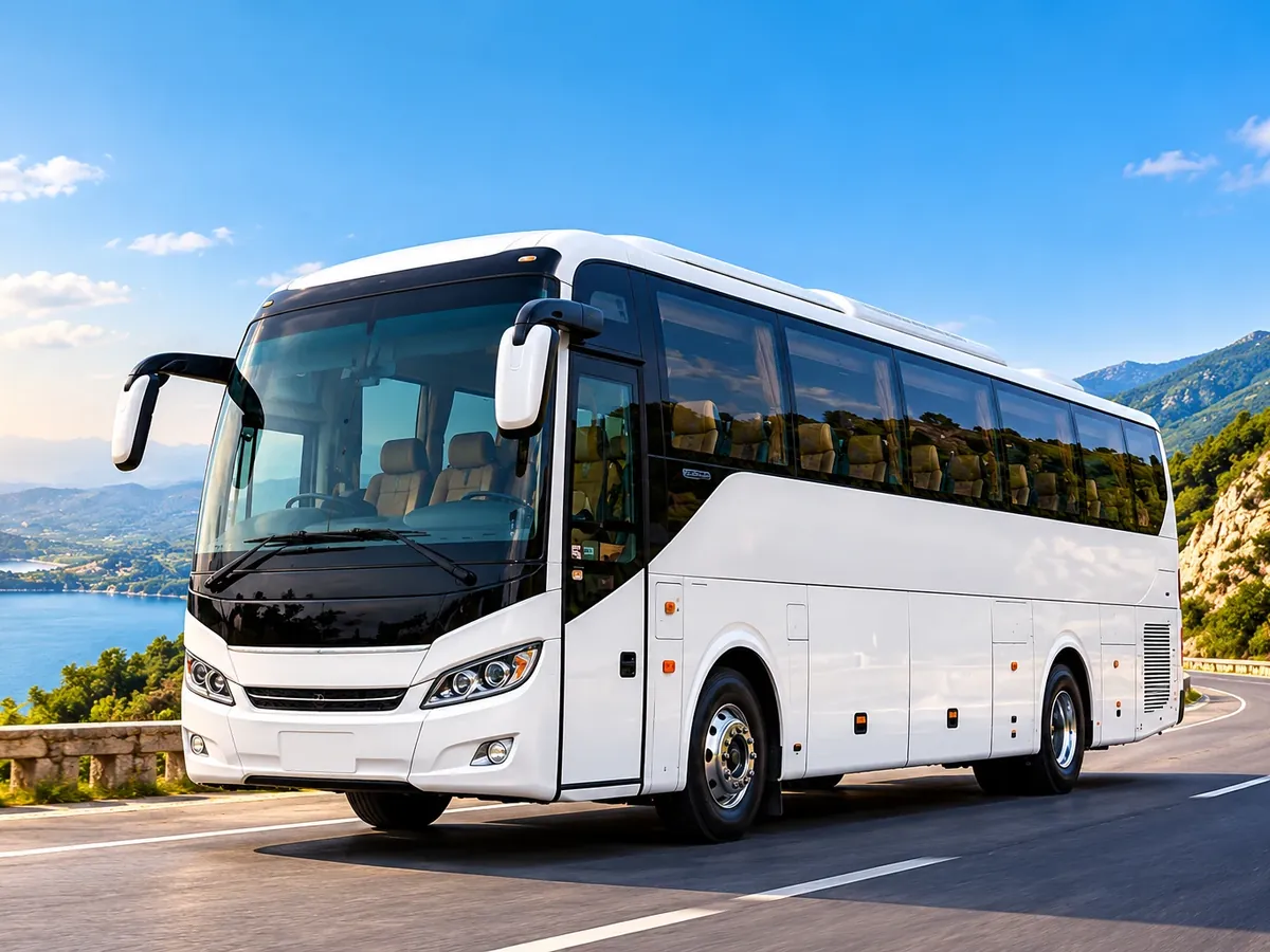 White tourist bus on a coastal highway